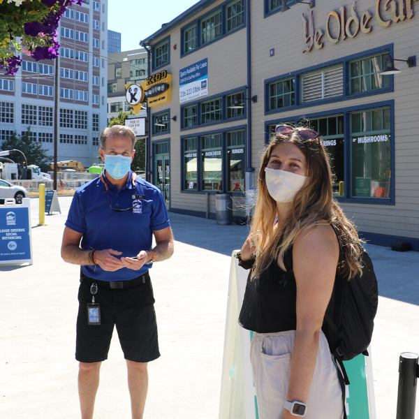 Argosy Cruises employee with a guest wearing mask
