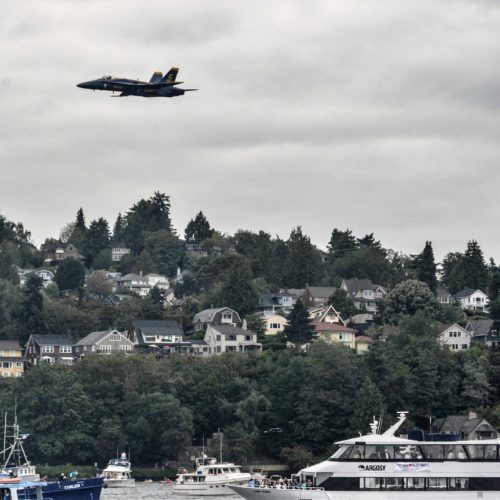 A Blue Angel jet zooming through the air during Seafair Weekend in Seattle