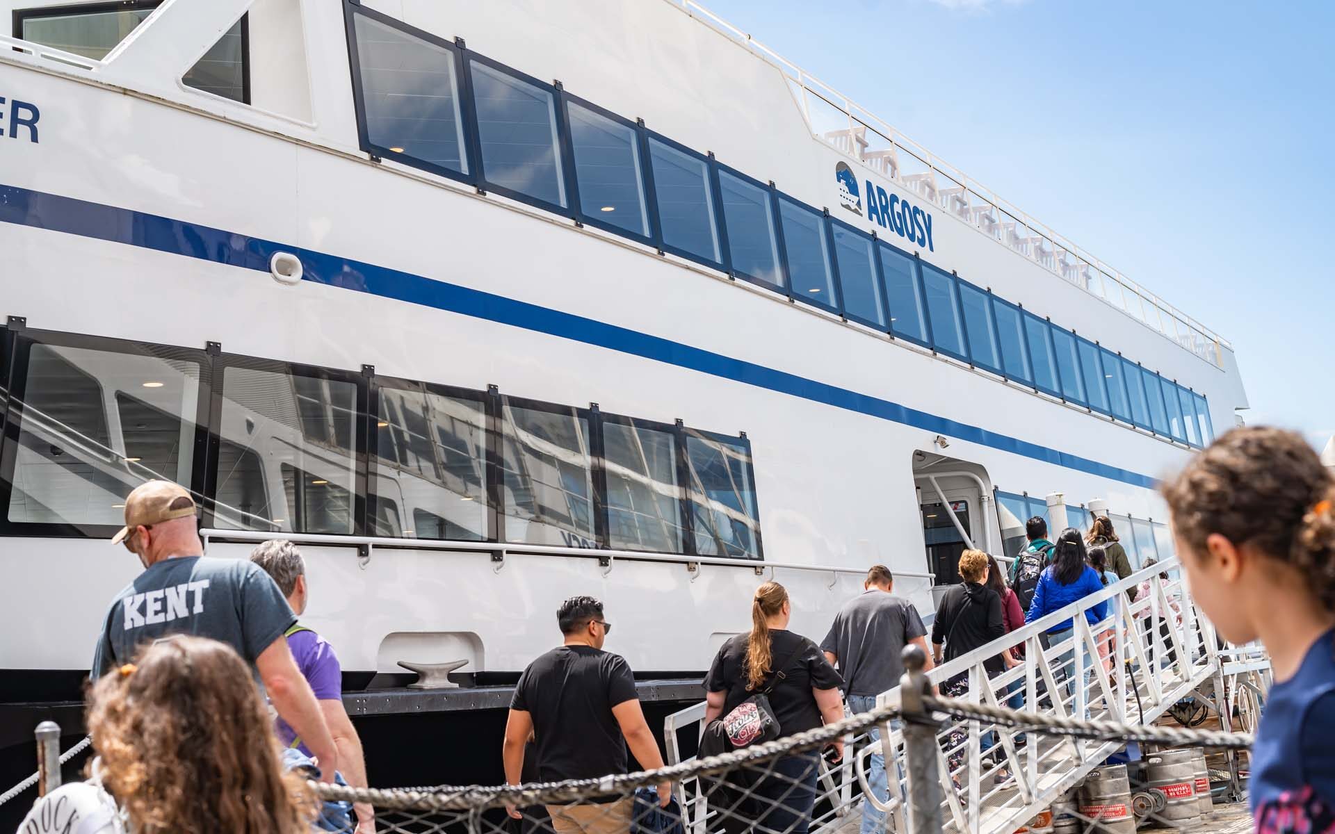 Line of people boarding Argosy Cruise